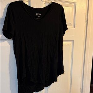 Women’s black T-shirt size extra small, but fits more like a medium